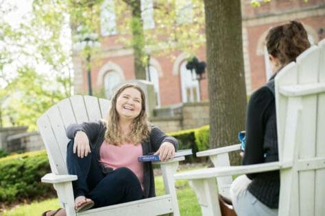 Students in the Adirondack chairs on campus outside of Old Main during the Creosote Affects photo shoot May 1, 2019年华盛顿 & Jefferson College.